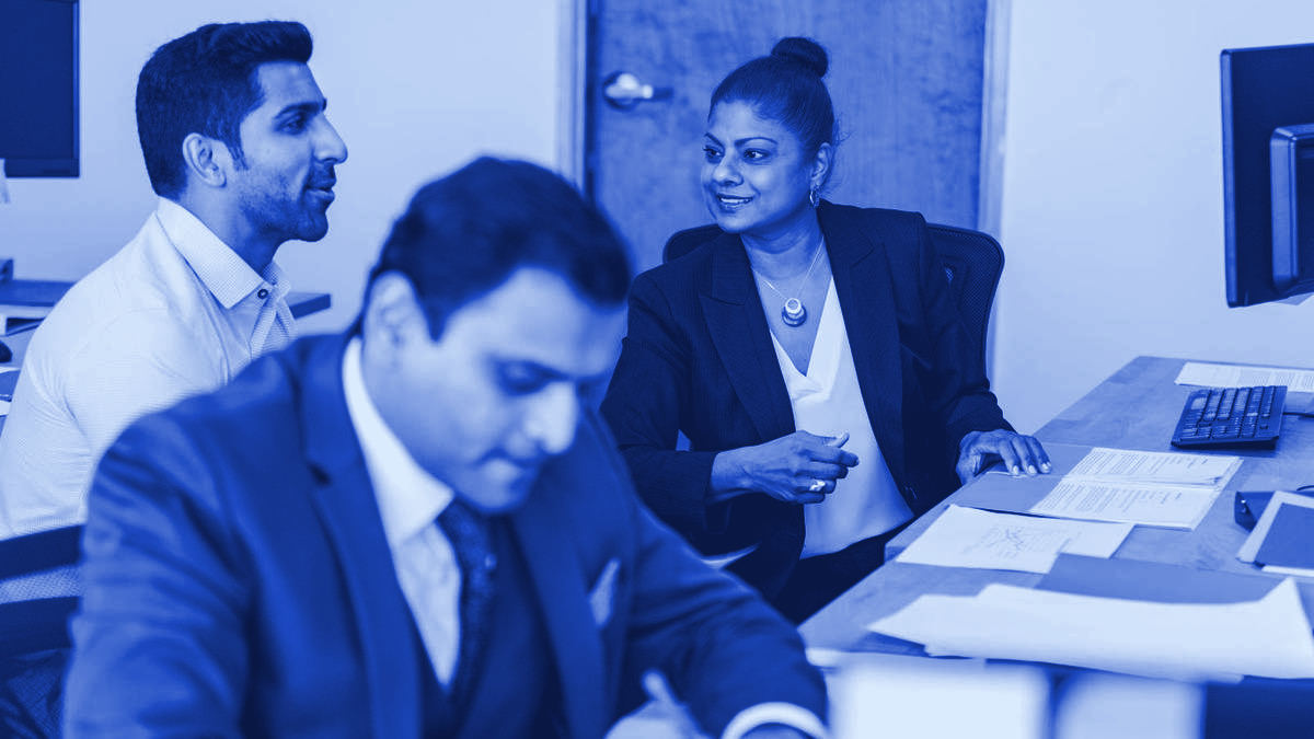 Two colleagues in conversation in an office