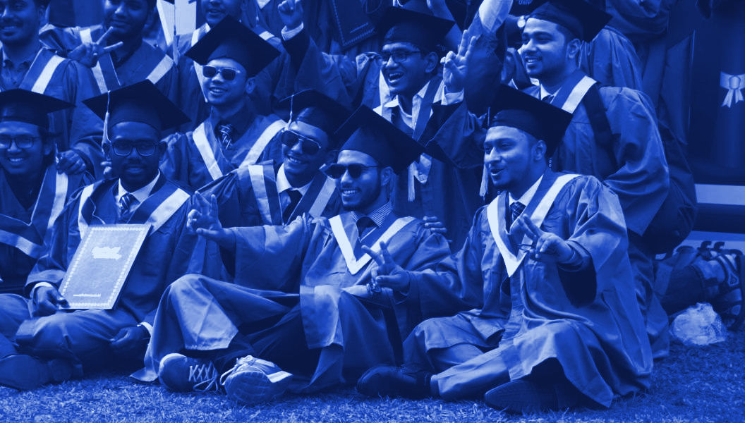 Indian graduates in caps and gowns at a convocation