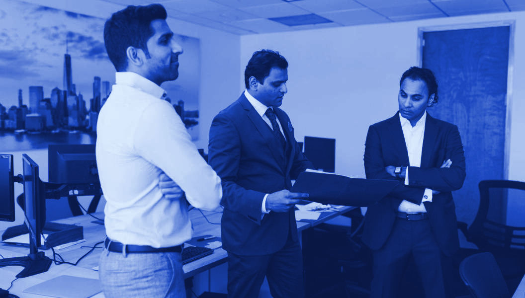 Colleagues reviewing documents together in an office