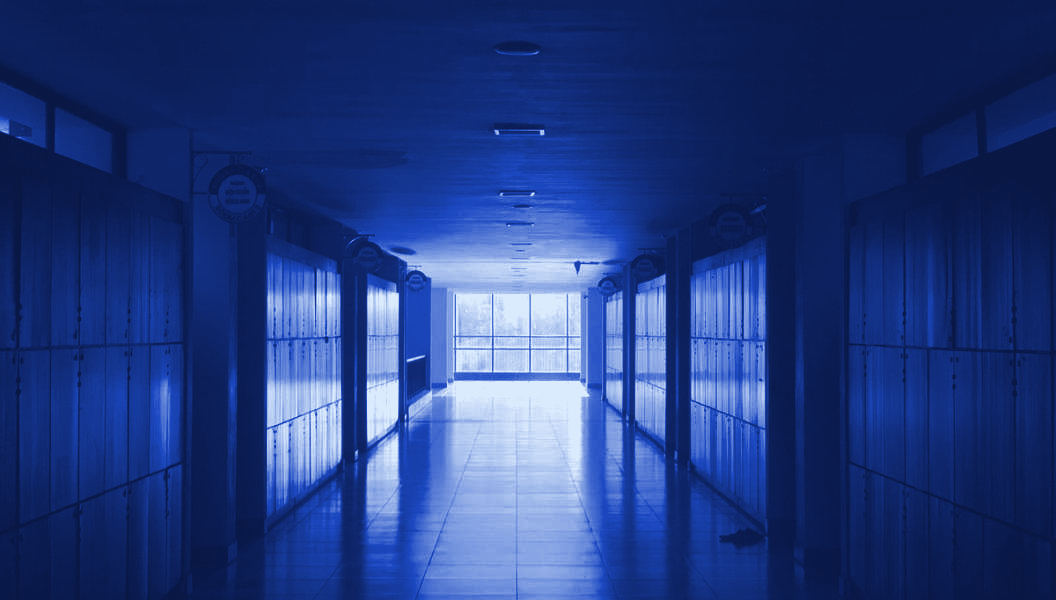 An empty college corridor lined with lockers