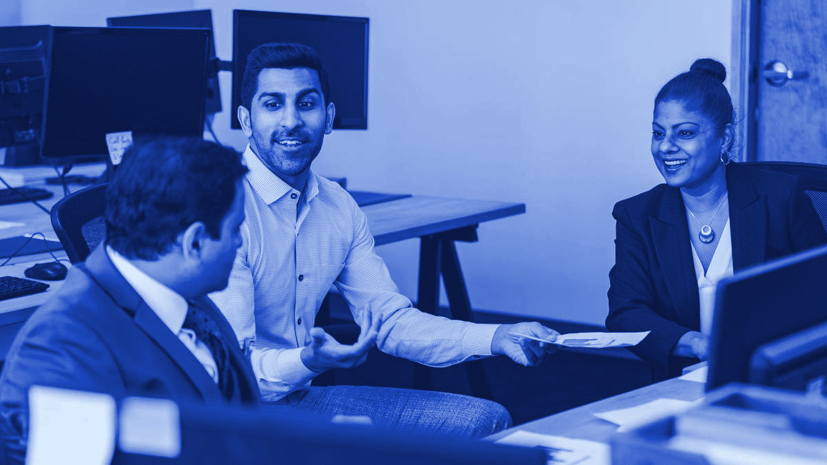 Colleagues in discussion in a modern office